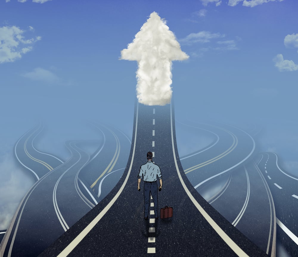 Career development business concept. Business man standing in front of many tangled roads with one highway leading up to arrow cloud as metaphor for leadership.