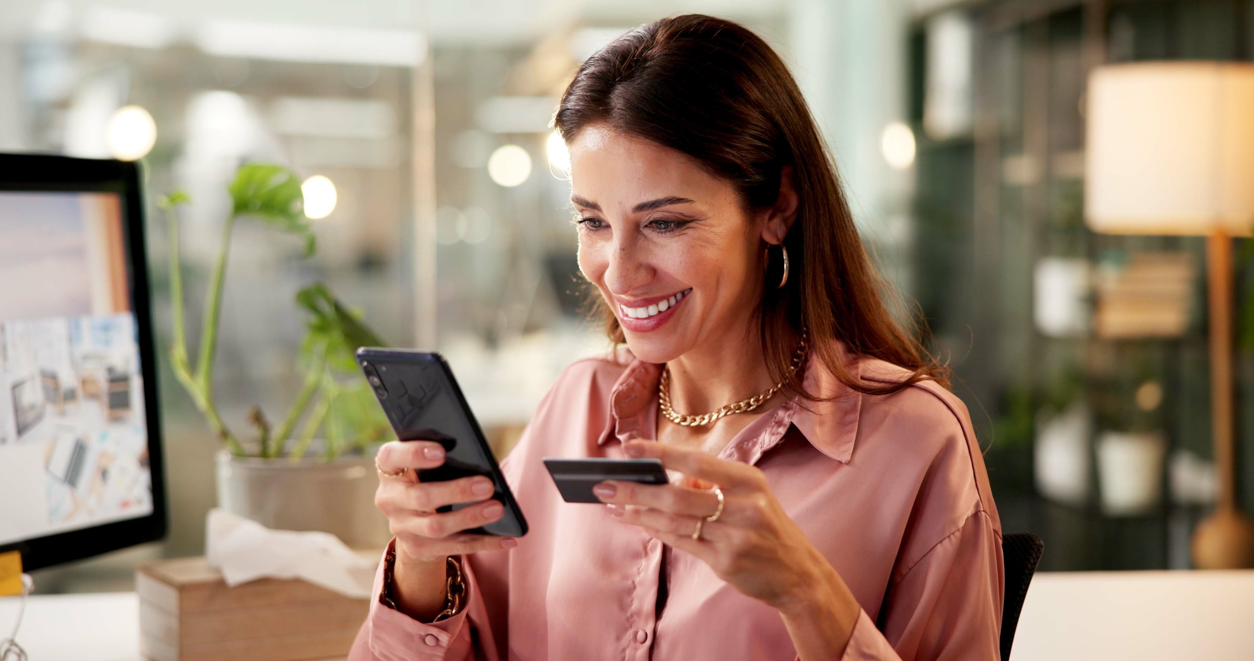 Happy woman, phone or payment with credit card for online shopping_1076066060-min